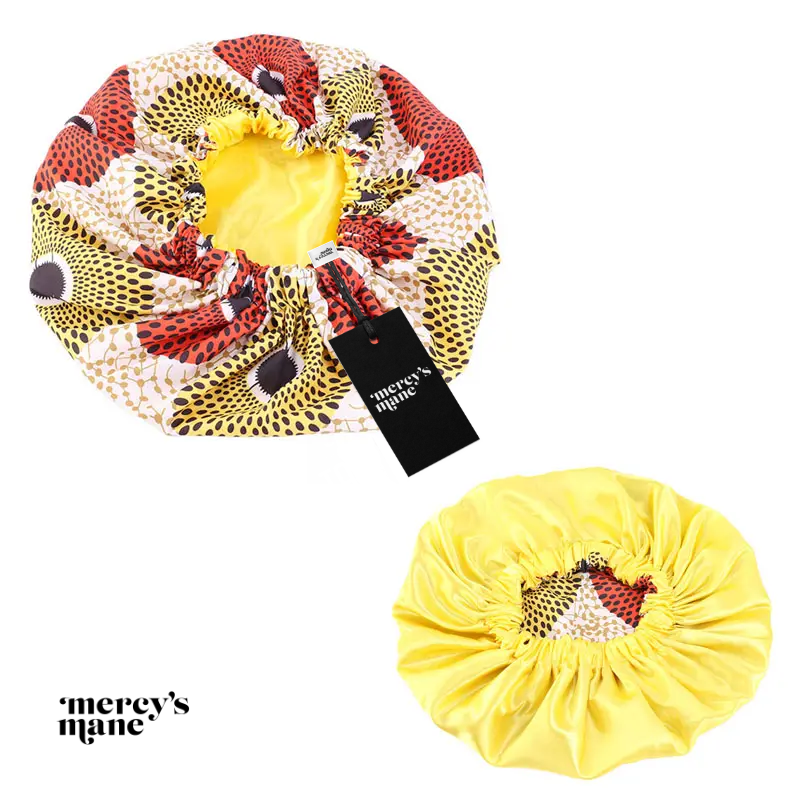Yellow satin bonnet that's comfortable to sleep in and helps to reduce frizz and maintain healthy hair.